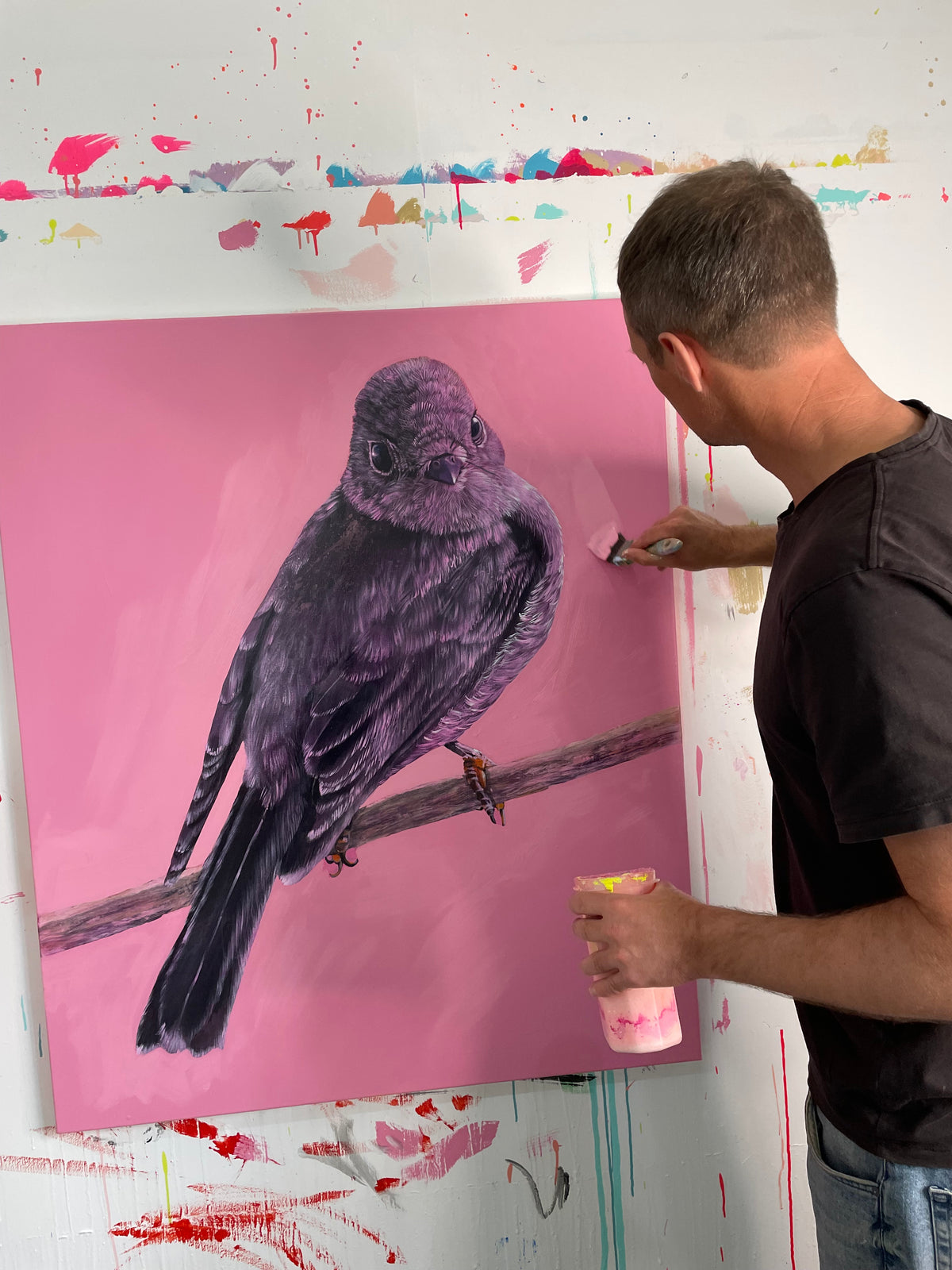&quot;So often it is the vibrantly colourful Male Rose Robin- Petroica Rosea that is showcased, photographed or painted, this painting is celebration of the beauty and subtle colours of the female. As a colourist I love working with pinks, there is so much nuance to them&quot;Geoffrey Carran. Phot of the artist painting in the studio